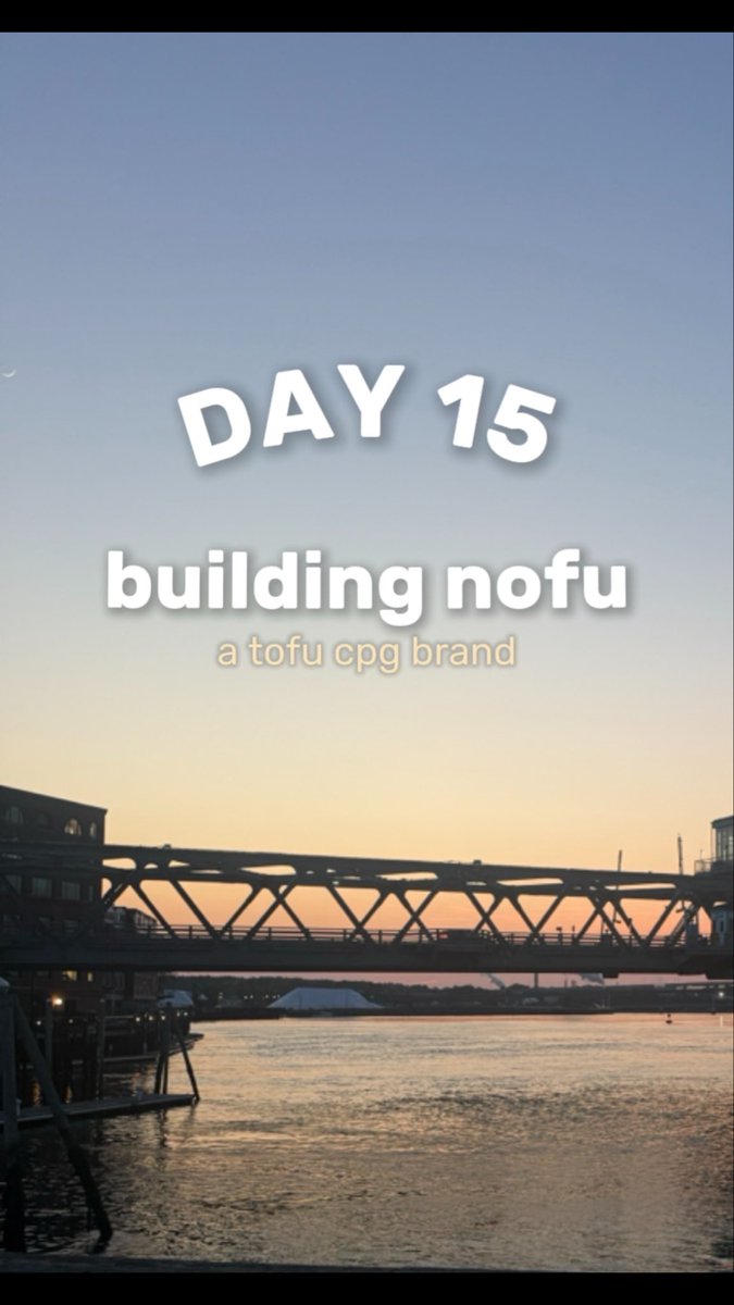 A sunset view of a bridge over water with the text 'DAY 15 building nofu a tofu cpg brand' overlaid on the sky.