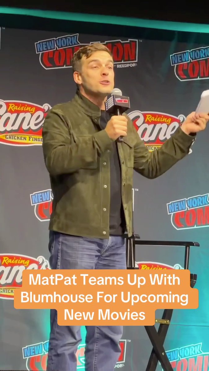 MatPat speaks at a New York Comic Con panel, holding a microphone, with Raising Cane's branding visible behind him. An orange caption overlay reads, "MatPat Teams Up With Blumhouse For Upcoming New Movies," tying into the announcement of his collaboration with Jason Blum during Blumfest at NYCC.