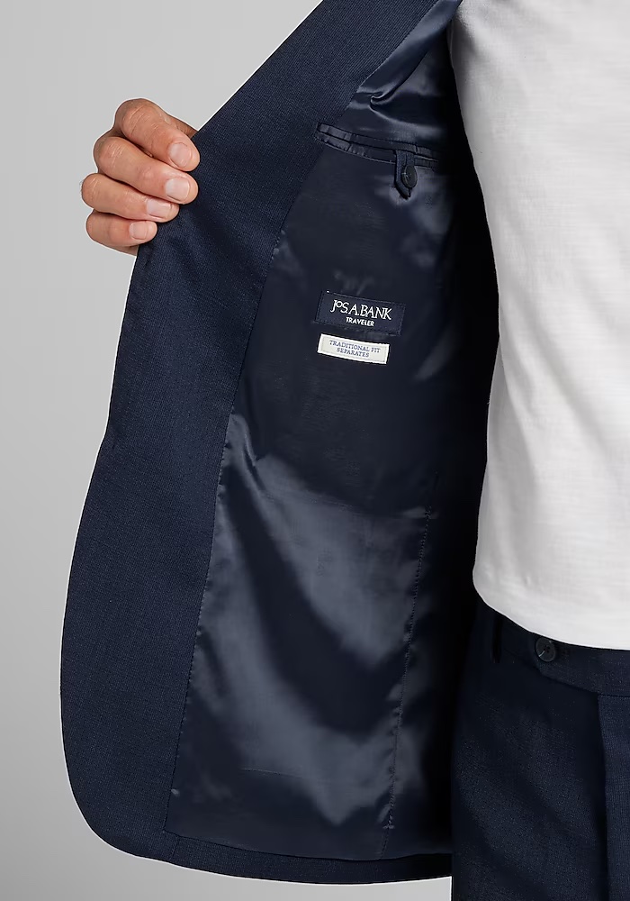 dieworkwear's tweet photo. Trump's suit appears to be part of Jos. A. Bank's Traveler line. The suit is listed as having been made abroad using a wool-polyester-spandex blend. The company describes it as having the "ultimate stretch" and was designed to minimize body odor. https://t.co/Vg9Ps5PuNQ