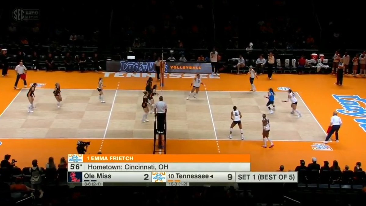 An SEC Network broadcast shows a volleyball match between Ole Miss (2) and Tennessee (9) in Set 1, featuring player Emma Frietch from Cincinnati, OH.
