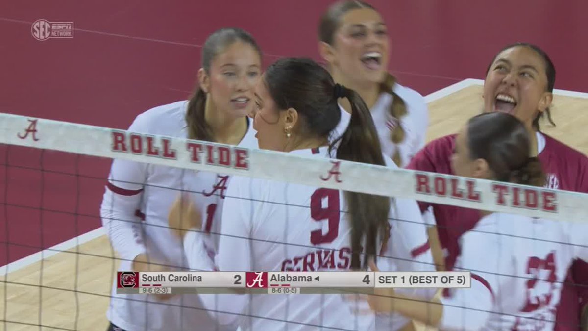An SEC Network broadcast showing Alabama volleyball players in white jerseys celebrating a point against South Carolina, with the scoreboard reading South Carolina 2, Alabama 4 in Set 1.