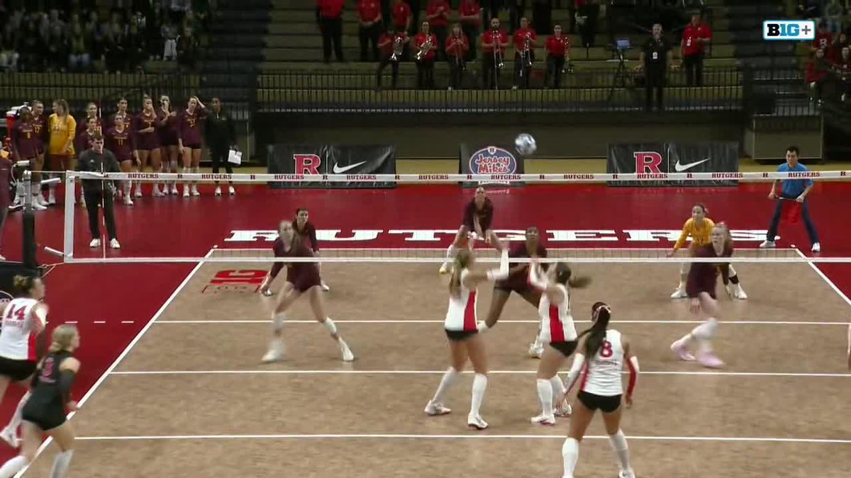A college volleyball match in progress at a Rutgers arena, broadcast on B1G+.