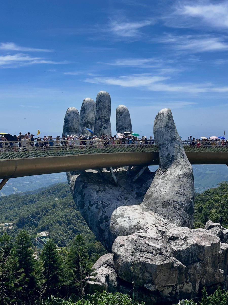 yatnulix's tweet photo. A Da Nang highlight: the Golden Bridge at Ba Na Hills. Its giant stone hands are even more impressive in person. It gets busy, but the cable car views and plenty to explore make the ticket worthwhile. Afraid of heights? Be prepared. https://t.co/snHTWGf2lC