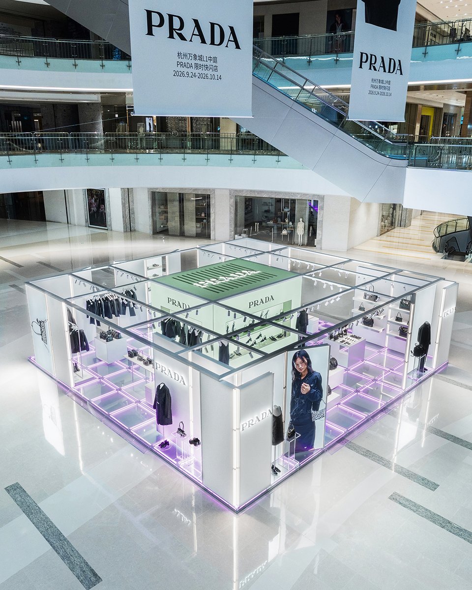 Prada's tweet photo. Prada Essence: chromatic duality through a selection of ready-to-wear and accessories. 
The new Prada Essence pop-up arrives at Hangzhou MixC, focusing on black and white opposites, which coexist within a single visual identity. Sleek silhouettes and design signatures bring to life a series of Prada styles that first gained recognition in the Nineties.  
Discover more: https://t.co/RvbWibvJ5r

#Prada