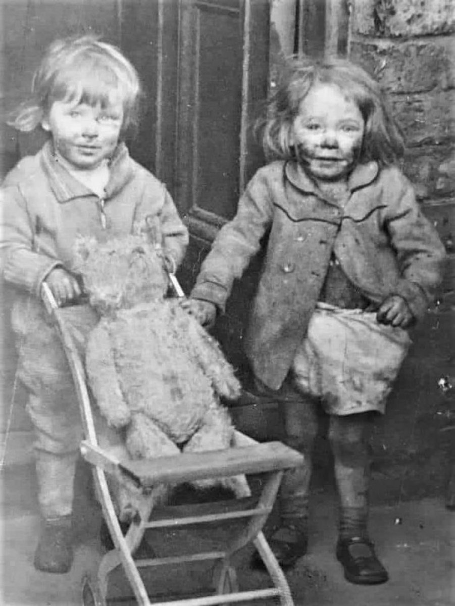 Johnnypapa64's tweet photo. Two little girls save their Teddy Bear during the blitz of Liverpool (1941) https://t.co/nG6uEo6swW