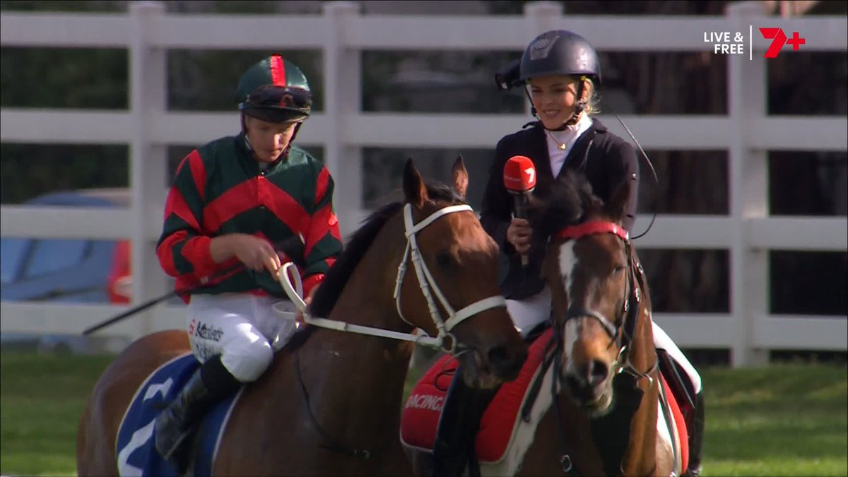 Two jockeys on horseback are shown at a racetrack, with a reporter holding a Channel 7 microphone; the broadcast displays a 'LIVE & FREE 7+' logo in the corner.