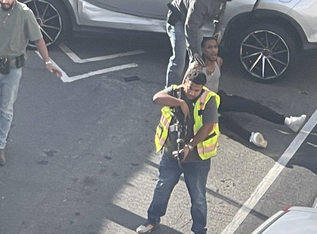 Weams1972's tweet photo. @MAGAVoice The new face of ICE. No uniform. No identification. No body camera. Just a random guy firing a gun at a car with a 5 year old inside. This is not America. https://t.co/RfEptjgpw8