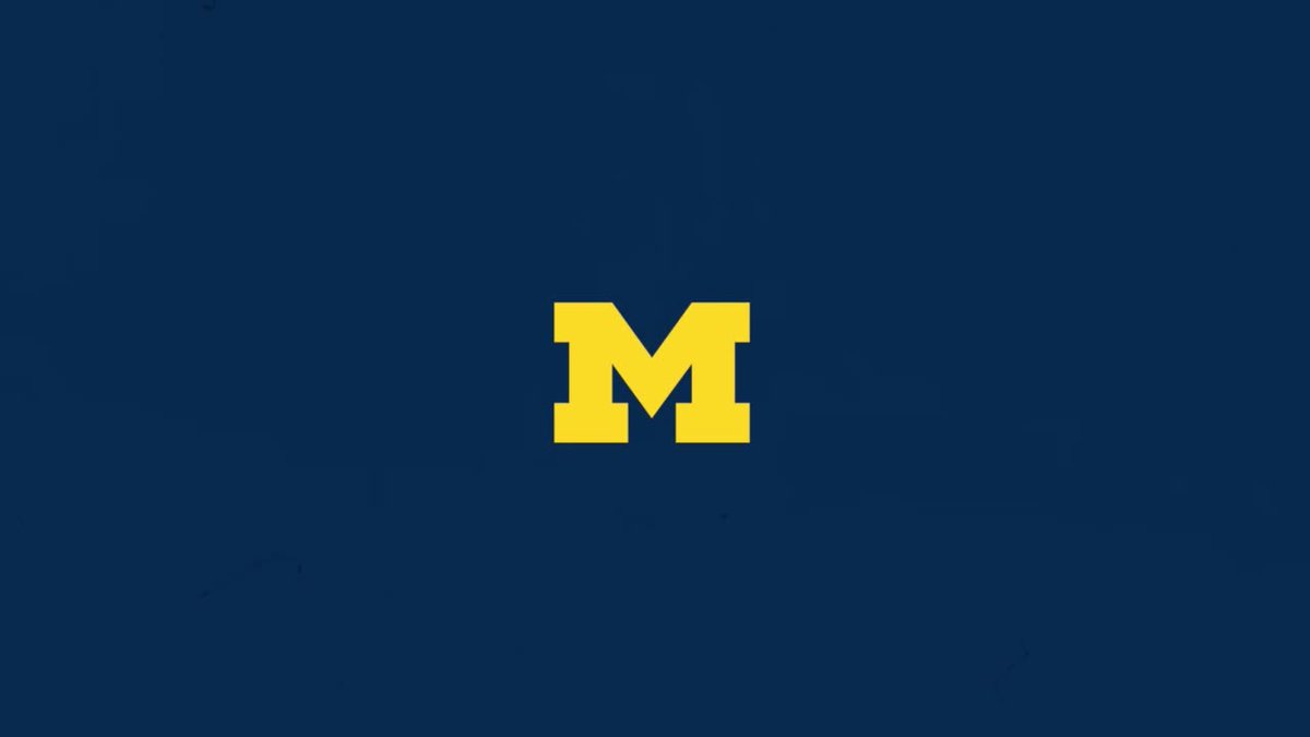 The image features the University of Michigan's distinctive block "M" logo in maize yellow against a navy blue background, serving as the team identifier for the baseball program celebrating highlights from their dominant 10-1 victory over Alaska Anchorage.