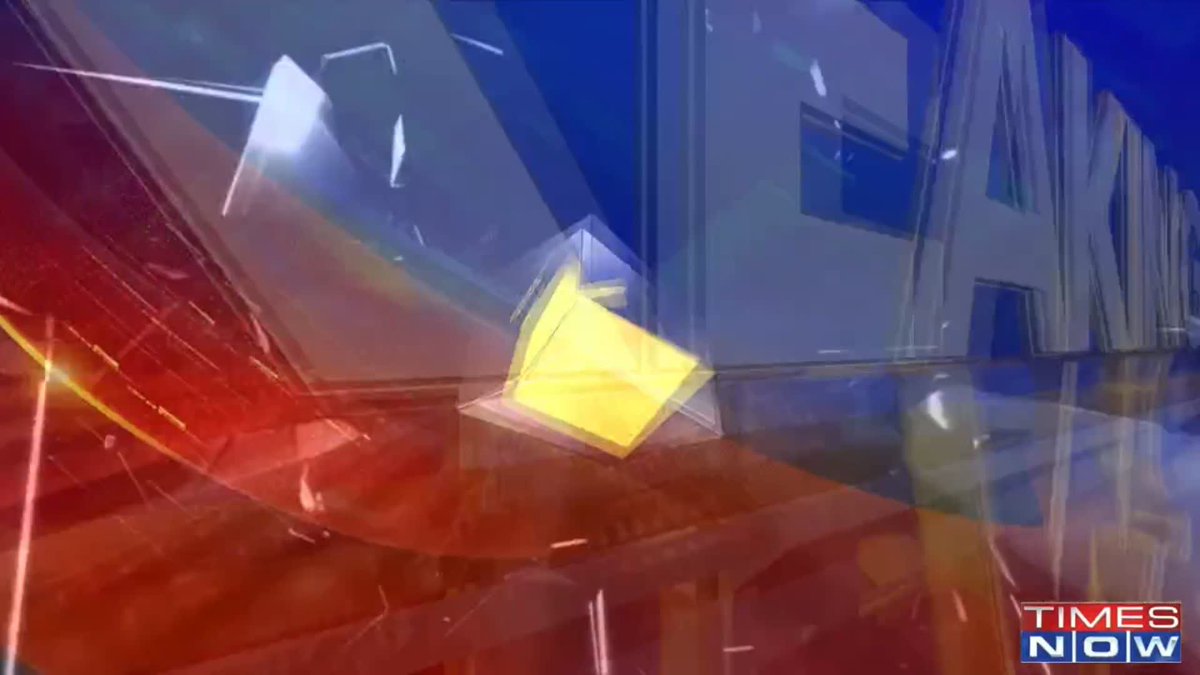 The image shows a stylized broadcast graphic for Times Now, featuring abstract geometric shapes in red, blue, and yellow with the channel's logo in the bottom right corner. The post mentions that CJP supporters gathered at Delhi Airport to welcome Abhijeet Dipke, suggesting this is a news broadcast intro or transition graphic leading into coverage of that event.