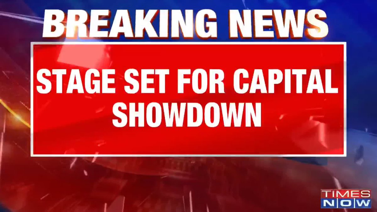 A Times Now breaking news graphic displays the headline "STAGE SET FOR CAPITAL SHOWDOWN" in bold white text on a red banner, accompanying a post about a CJP protest in Delhi where 150 protesters have been detained so far.