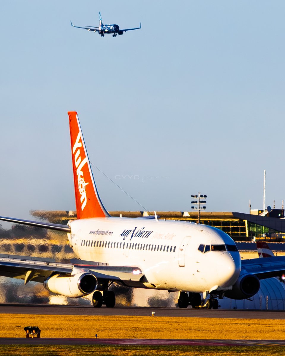 CYYCspotter's tweet photo. @flyairnorth @Boeing 737 200C C GANV slowing on runway 17R at @FlyYYC after arriving from Whitehorse via Edmonton, with WestJet’s Mickey Mouse themed 737 on final for 17L in the background. C GANV served Air North from 2008 to 2019. ✈️🇨🇦 #AvGeek #AirNorth #WestJet #YYC #Boeing737 https://t.co/kFnBDUOFnx