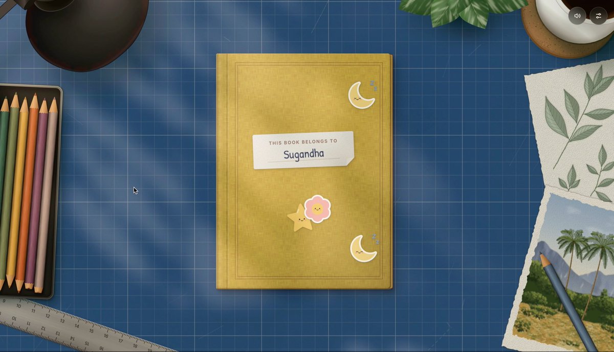 A yellow notebook on a blue grid desk with a 'THIS BOOK BELONGS TO Sugandha' label, decorated with cute moon and flower stickers, surrounded by colored pencils, a ruler, and pressed leaves.