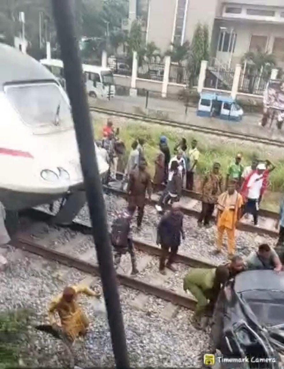 Answrites_'s tweet photo. A 55-year-old driver cheated death and escaped unhurt after a train rammed his Honda car at the PWD rail crossing in Lagos. The vehicle, marked EKY 902 JT, was badly damaged. LASTMA officials rescued the driver, cleared the track, and handed the wreckage to security operatives for investigation, though traffic gridlock persisted in the area.

#Nigeriawehailthee
