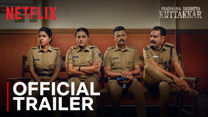 Netflix Official Trailer thumbnail for 'PRADHAMA DRISHTYA KUTTAKKAR' showing four police officers in uniform sitting on a bench.