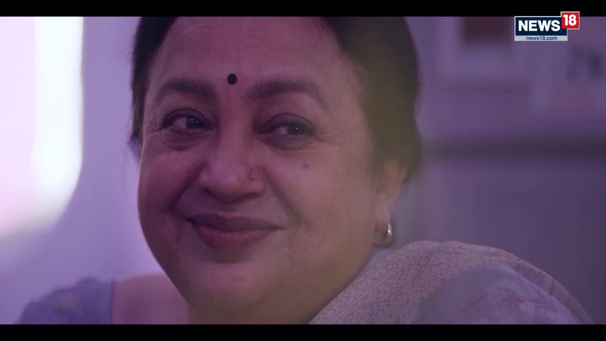 A close-up shows a smiling woman wearing a bindi and traditional attire, with the "NEWS18 news18.com" logo in the top right corner, likely an interviewee featured in the broadcast discussing Elon Musk's Starlink satellite internet controversy in India.