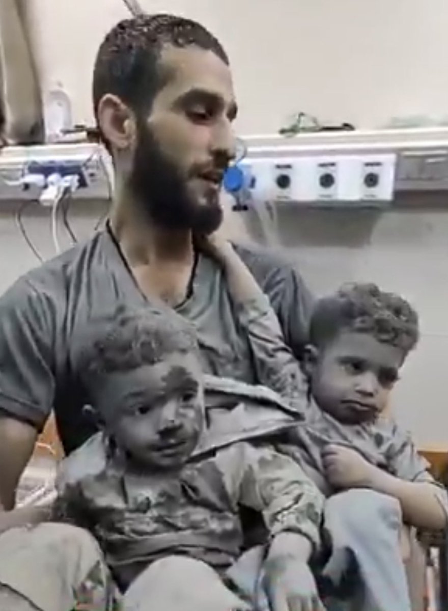 FadyAbw1955's tweet photo. Their mother is martyred.

A father emerges from death holding his two children, covered in dust.

In Gaza, children learn loss before they learn to speak.

#GazaGenocide #Gaza https://t.co/xZUw0WMc51