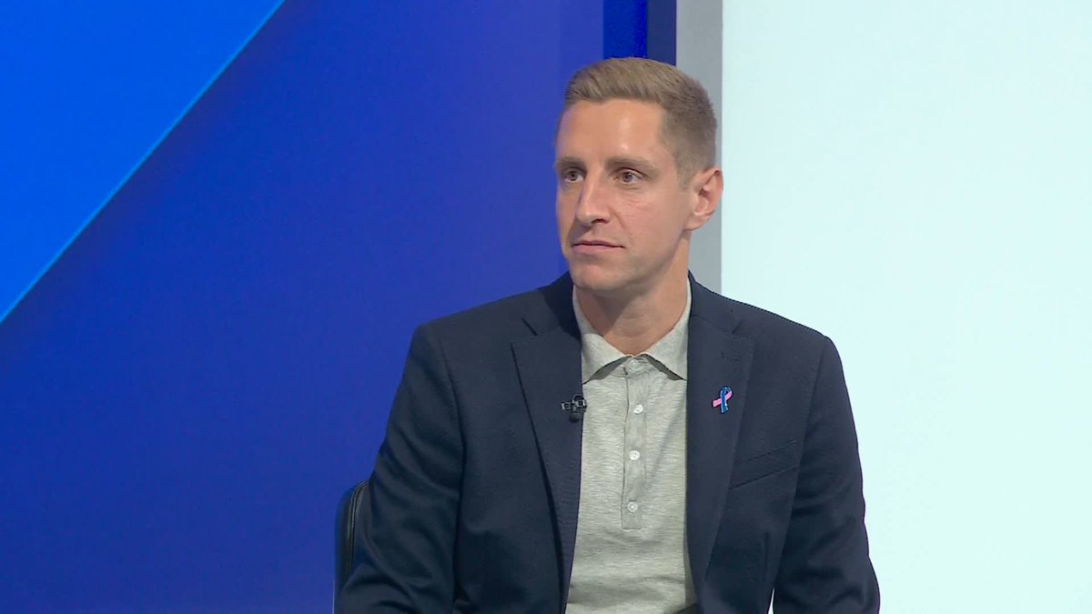 A man in a dark blazer and gray polo shirt appears during what looks like a sports broadcast interview, with the context suggesting the discussion is about Tottenham Hotspur's (Spurs) struggles despite significant spending and whether the international break offers a chance to reset. His serious, contemplative expression reflects the critical tone of the commentary about the team's declining performance.