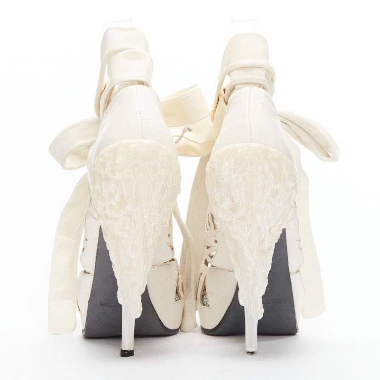 georaama's tweet photo. #shoecam Trinity Tatum wearing the Nicolas Kirkwood for Rodarte fw2010 melted wax heels https://t.co/WCmqemkrA6