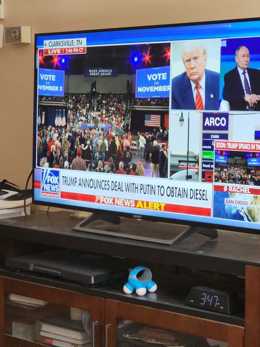 A Fox News broadcast on a TV shows Trump announcing a deal with Putin to obtain diesel, with a Clarksville, TN live feed and ARCO gas prices visible.