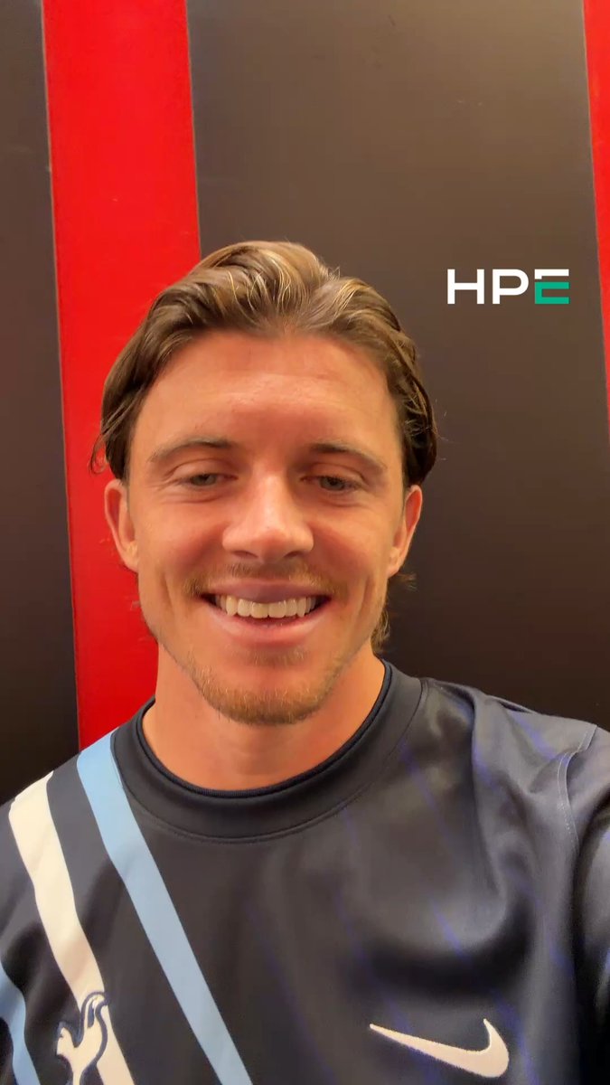 A young man with a bright smile takes a selfie in front of a backdrop displaying the "HPE" logo, appearing to share a personal message of gratitude as referenced in the accompanying post about Conor's thanks for support.