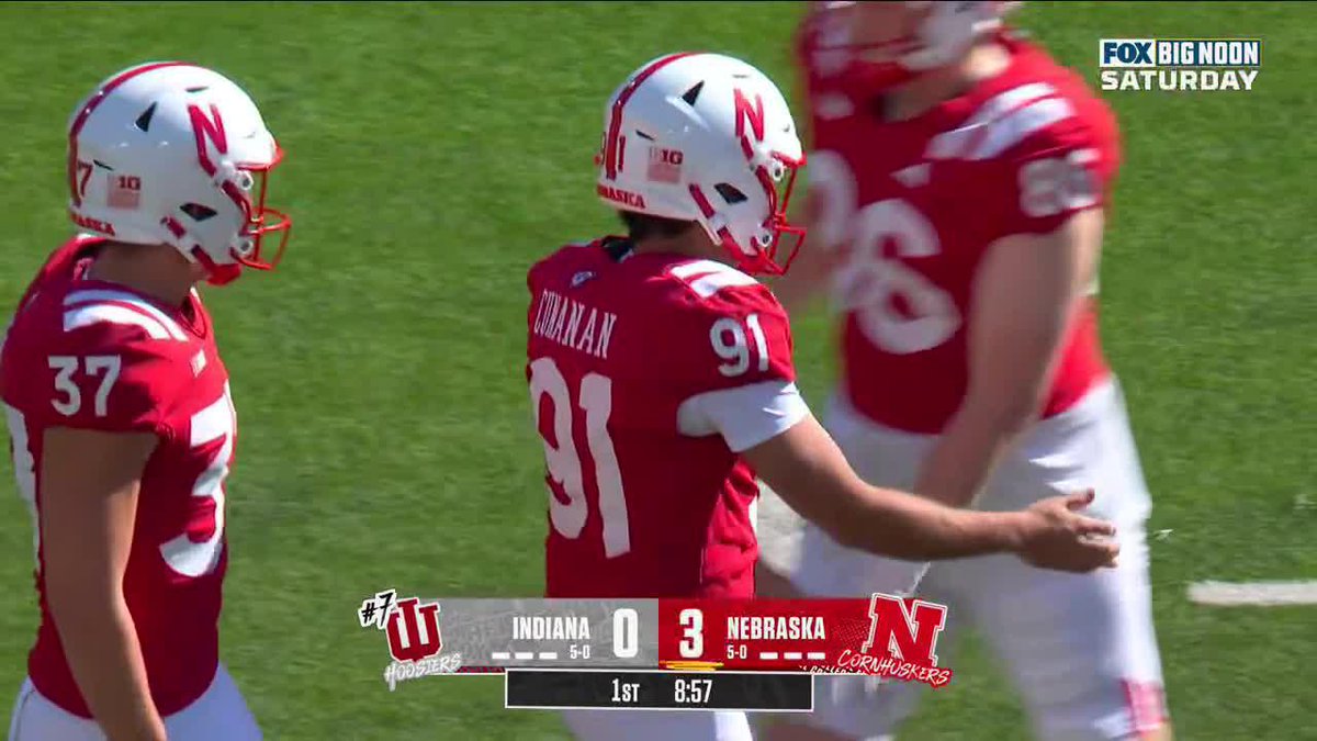 A screenshot from the Indiana vs. Nebraska game on Fox Big Noon Saturday shows Cornhuskers player #91 Cunanán alongside teammate #37, with Nebraska leading Indiana 3-0 in the 1st quarter at 8:57, marking the first time the previously undefeated 5-0 Hoosiers have trailed this season.