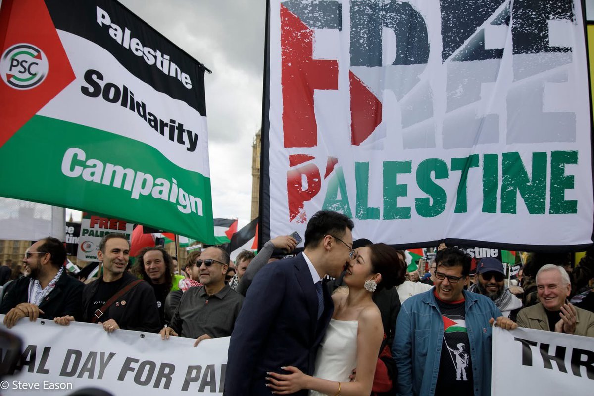 JohnWRees's tweet photo. Got to be honest, my favourite moment on the Palestine demo: At Westminster Bridge these newly marrieds were having photos taken with Big Ben as a backdrop. They were pro Palestine. I asked them if they wanted pictures in front of the demo…they were overjoyed, and so were we… https://t.co/qL7McgJLq0
