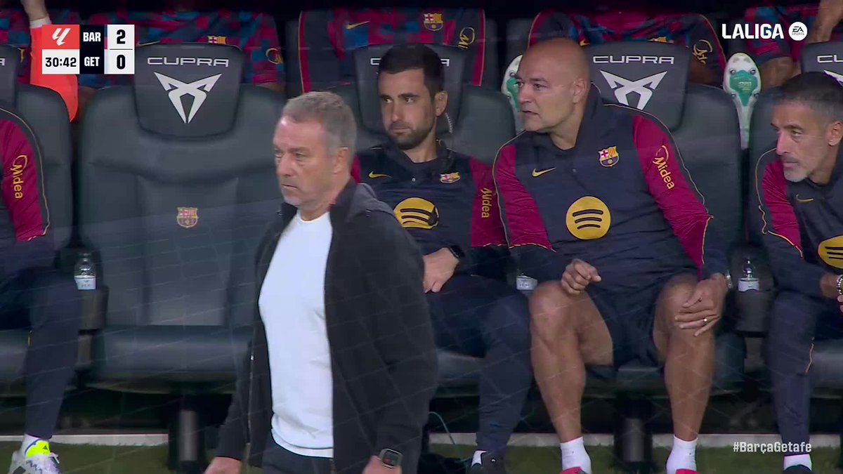 Hansi Flick stands on the sideline with FC Barcelona leading Getafe 2-0 at 30:42, as shown on the LaLiga scoreboard, following Gabriel Jesus's goal celebration.