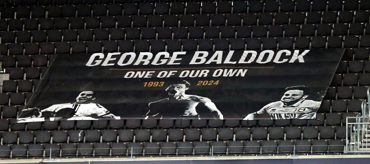 DonsAction's tweet photo. On a positive note, what a wonderful moment with all 4 sides of the stadium coming together to remember George Baldock.

It was amazing to see the players stop on the pitch to share the moment with the fans.

You will forever be one of our own, George🤍. https://t.co/bJK8TcBdt4