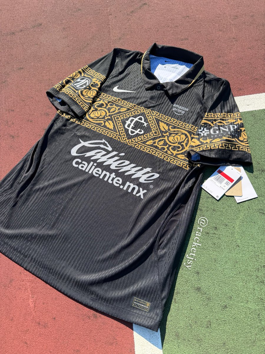 RacketJSY's tweet photo. Introducing a first look at the new 2026/27 #chivas Third Kit in this stunning Black &amp; Gold color way.

I genuinely was not a fan of the jersey when it was rumored a few days ago, but having it in hands it definitely is a beauty of a kit.

Jersey was raffled on our insta. https://t.co/vEo7H9LEVu
