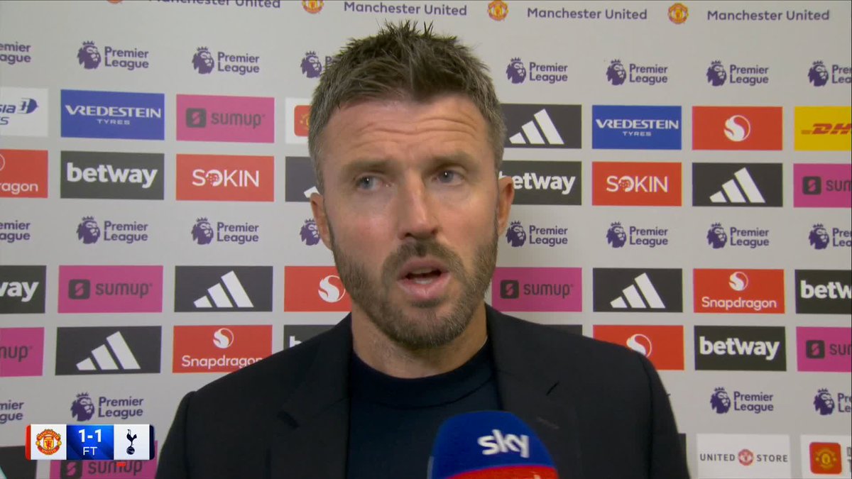 Michael Carrick is shown in a post-match interview setting, speaking in front of a backdrop covered with Manchester United and Premier League logos alongside sponsors like Adidas, Snapdragon, and Betway. The score graphic in the bottom left reads "1-1 FT" with the Manchester United and Tottenham Hotspur (Spurs) crests, indicating the match that just concluded.