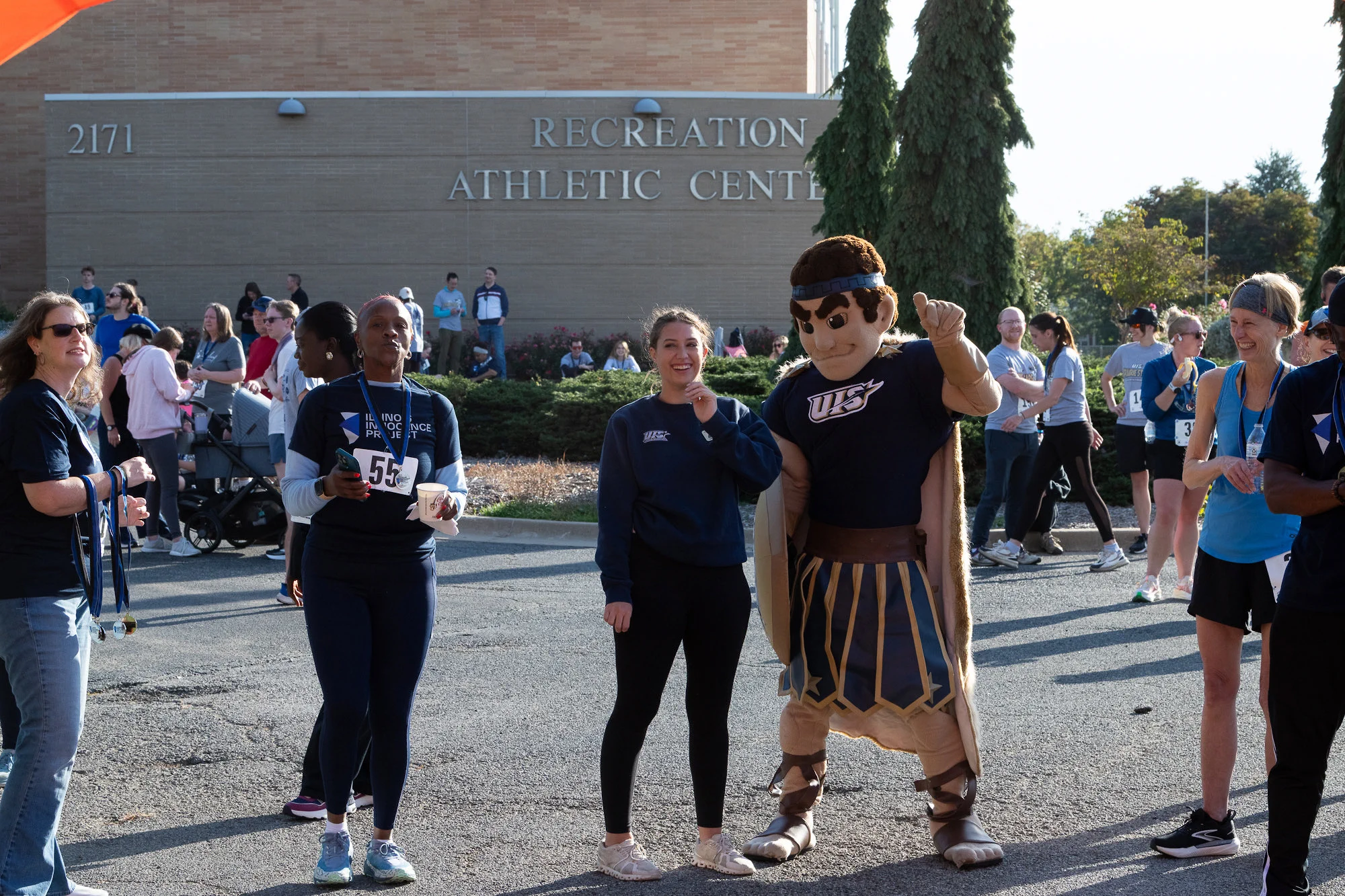 UIS mascot Orion poses with participants following the Prairie Stars 5K and 1 Mile Walk.