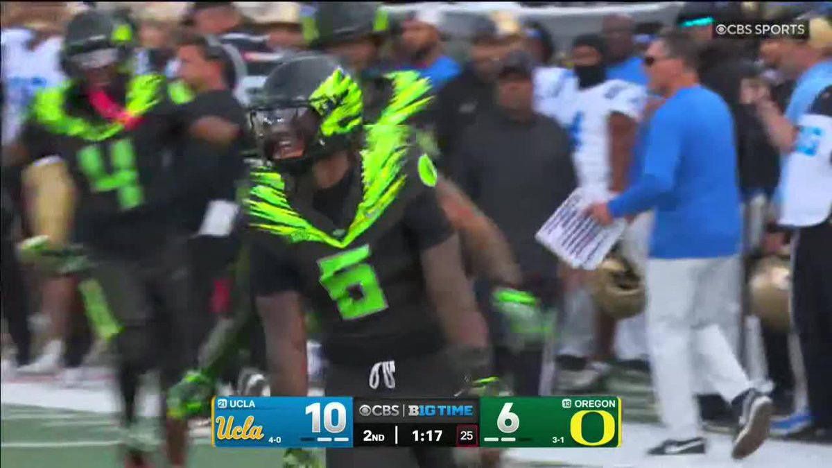 An Oregon Ducks football player wearing jersey #6 celebrates on the sideline during a CBS Sports broadcast, with the scoreboard showing UCLA leading Oregon 10-6 in the 2nd quarter with 1:17 remaining. The image aligns with the post by Jerry Mixon highlighting an Oregon football moment on CBS.