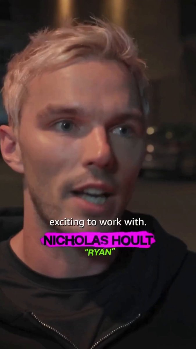 Close-up of an interview with actor Nicholas Hoult, identified by on-screen text as playing 'Ryan,' with the caption 'exciting to work with.'