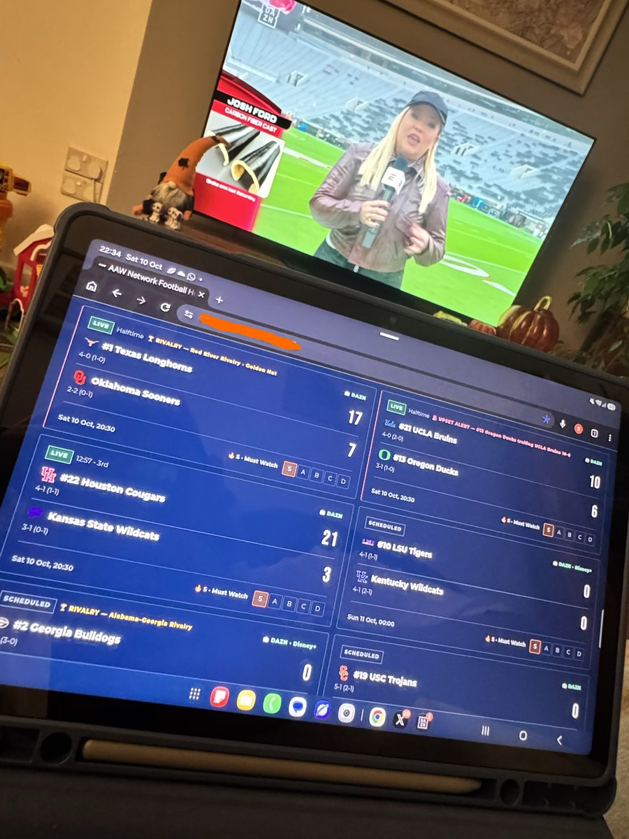 SamRam47's tweet photo. #RedRiverRivalry on the main TV, @AAW_Network CFB score on the tablet 🤘🏻🤘🏻 https://t.co/cEqciD26pf