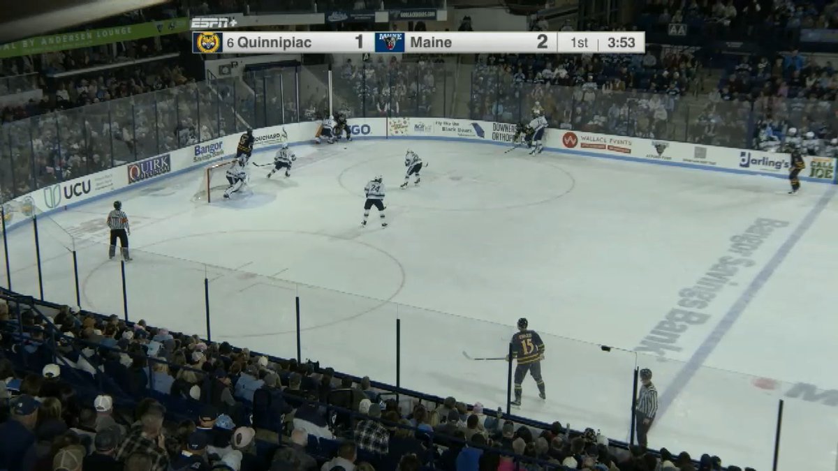 A screenshot from an ESPN+ broadcast of a college hockey game showing Quinnipiac trailing Maine 1-2 in the 1st period with 3:53 remaining.