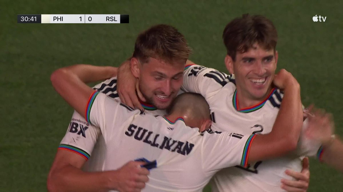Philadelphia Union players, including Sullivan, embrace in celebration after Bruno Damiani's stunning goal, giving PHI a 1-0 lead over RSL at 30:41 as shown on the scoreboard.