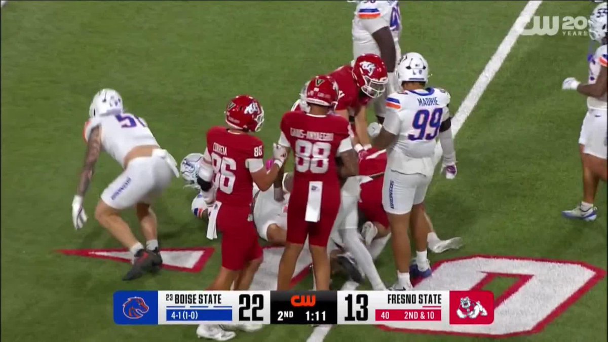 A college football game between Boise State and Fresno State, with Boise State leading 22-13 in the 2nd quarter with 1:11 remaining, showing players in red Fresno State and white/blue Boise State uniforms on the field.