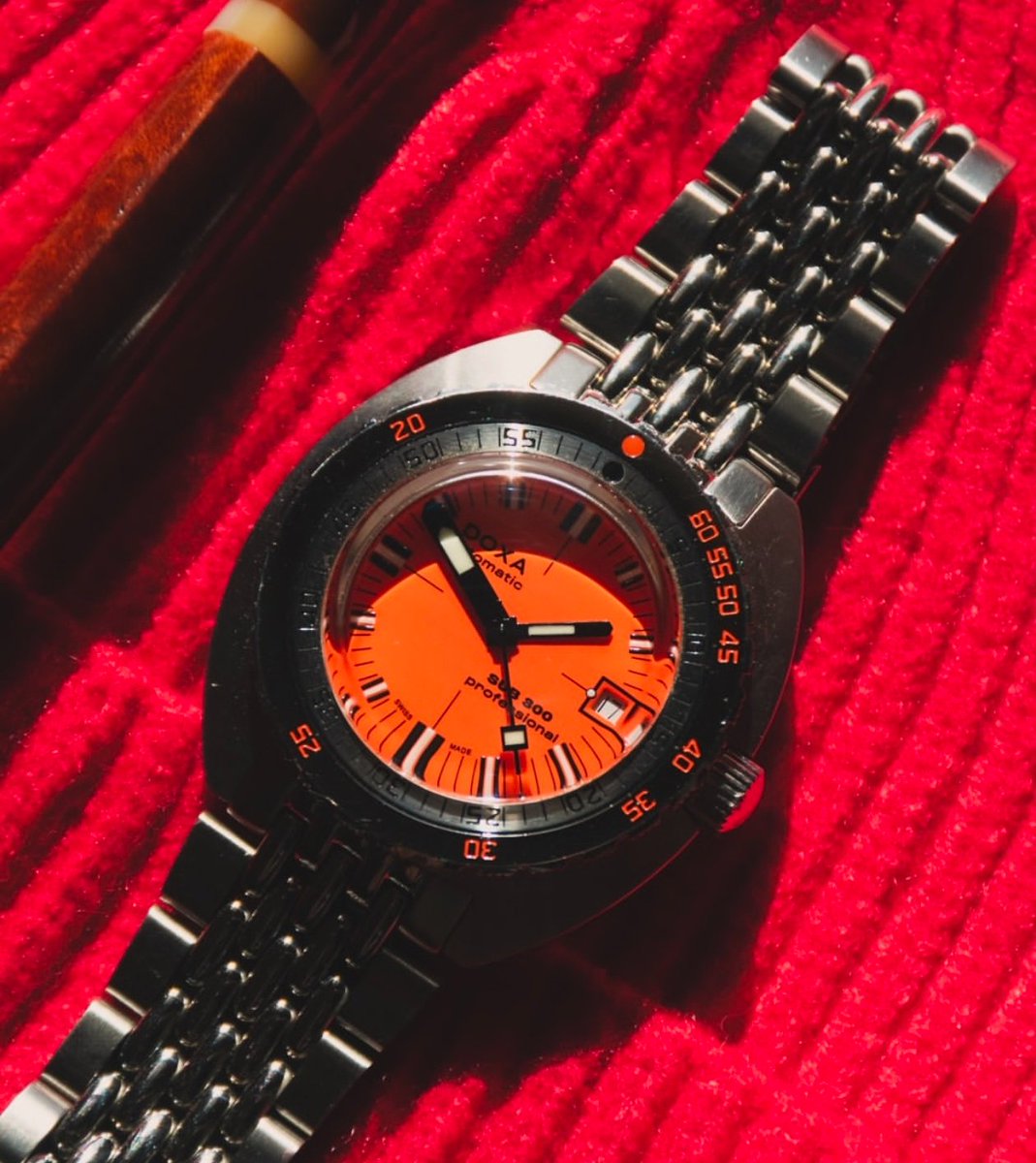 BossCode_12's tweet photo. A red cap. An orange dial. Some legends don't need an introduction. https://t.co/kj0Ryo4aIN