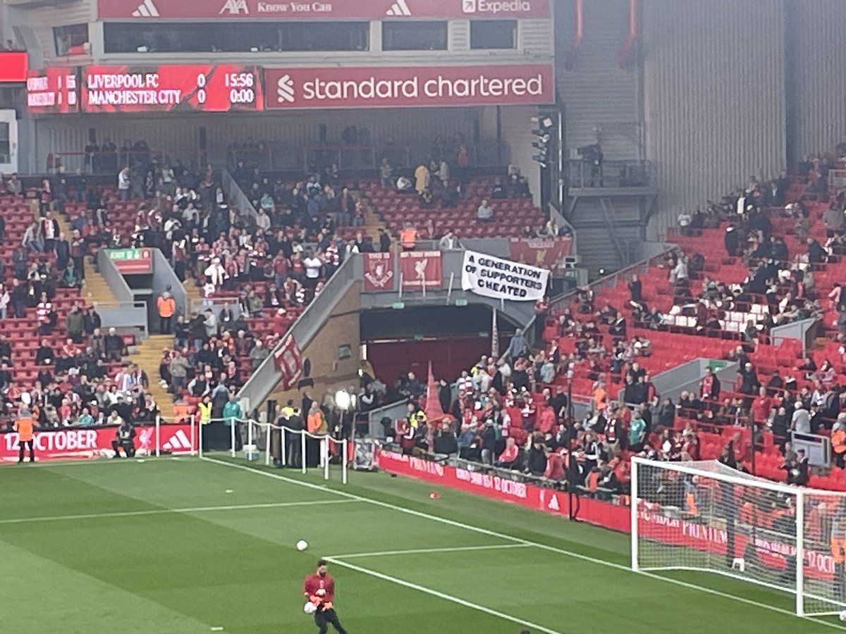 OllieHolt22's tweet photo. ‘A generation of supporters cheated,’ a flag in the Kop says https://t.co/8xTew4TlKY