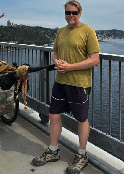 RussellQuantum's tweet photo. In his twenties, Karl Bushby drew a line across the map on his wall. He has spent twenty-eight years walking it since & he's now only about 250 miles from the end. 🗺️

The line came from a birthday card. Sometime in the mid-1990s his father sent him one with a note inside: two Special Forces soldiers had been arguing about whether a person could walk from London to New York by way of the Bering Strait. 

Bushby, then a paratrooper stationed at Connaught Barracks behind Dover Castle, went to his map & drew it. London, across Europe & Asia, over the strait, down through the Americas to the southern tip of Chile.

He set off from Punta Arenas on 1 November 1998, walking the line backwards, north toward home. Two rules: no transport to advance the journey & no going home except on foot. He thought it would take 12 years.

The Darién Gap came first & 18 days in a Panamanian jail on the far side of it. In March 2006 he crossed the Bering Strait on foot over pack ice with French adventurer Dimitri Kieffer - a 150-mile detour across the ice to cover a 58-mile strait, 14 days & was even arrested by Russian border troops on arrival for not using an official port of entry. 

Russia banned him for 5 years in 2013; he walked 3,000 miles across America to protest outside their embassy in Washington. The 2008 crash took his sponsors & stranded him in Mexico for 2 years.

Then Siberia, Mongolia, Central Asia. 

In August 2024 he swam 179 miles across the Caspian Sea to avoid Iran & Russia which took him 31 days, 132 hours in the water. Turkey, the Bosphorus, into Europe. Brexit-era visa limits kept pushing him back out of the Schengen zone to wait in Mexico.

Eurotunnel refused his request to walk the service tunnel. So on 5th of October he swam the Channel instead, about 20 hours across three days, untrained & came ashore at Shakespeare Beach near Dover - beneath the cliffs where he'd been stationed when he drew the line.

He's covering 20 to 25 kilometres a day now, down from 30. About 250 miles left to his mother Angela's house in Hull, where he hasn't been since 2015. 

He expects to arrive in early November. He's called the ending "a hard stop" & "the end of a life."