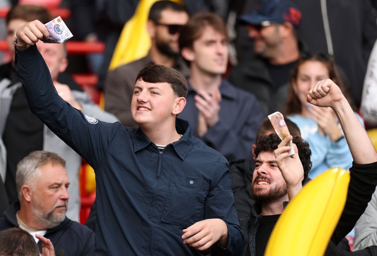 Footballtweet's tweet photo. Manchester City end wave cash at the Liverpool fans at Anfield. https://t.co/CYZR5cKbYg
