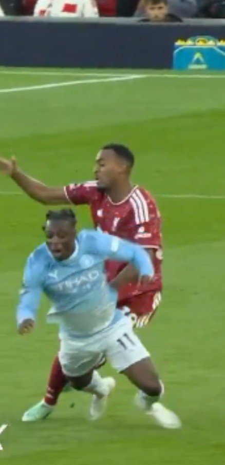 tomisinfcb's tweet photo. 🚨Jamie Carragher on Ryan Gravenberch's red card for the challenge on Jérémy Doku:

“Honestly, I'm watching that decision and asking myself what exactly the referee has seen. How have we reached the point where a player can be sent off for an incident like that?

From the angle I've seen, there doesn't appear to be any contact on Doku. So where has this red card come from?

I'm not saying referees have an easy job. I played football for years, and I understand how difficult it can be to make decisions in real time. But that's precisely why we have VAR. It's there to correct obvious mistakes, not to make people even more confused about what they're watching.

At this point, it feels like they're not even hiding it anymore. How can you look at that incident and send Gravenberch off when there's no contact on Doku?

And when you're Liverpool, these decisions become even more frustrating because of what's at stake. Every point matters. Every player matters. One questionable decision can change the entire game, and suddenly you're expected to accept it and move on as if nothing happened.

I'm questioning the consistency. That's the biggest problem. Supporters want to understand the rules, players want to know where they stand, and managers want to believe that decisions will be made fairly.

Liverpool shouldn't have to spend the next few days talking about referees instead of football. We should be discussing the players, the tactics and the match itself.

The Premier League sells itself as the best league in the world. Yet decisions like this leave everyone talking about the referee instead of the football.

That's a serious problem, and somebody needs to explain it.