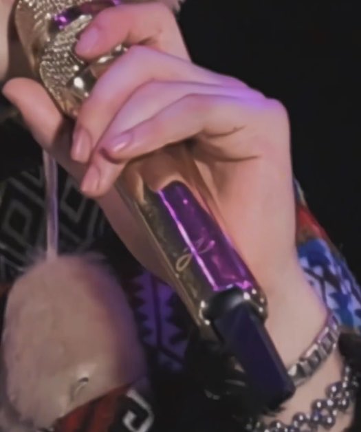 jungkookmaxxing's tweet photo. his hair is getting so long 🥺 and his pretty fingers and his logo on the mic 😭😭💘💘 https://t.co/E4X3IlYy2h