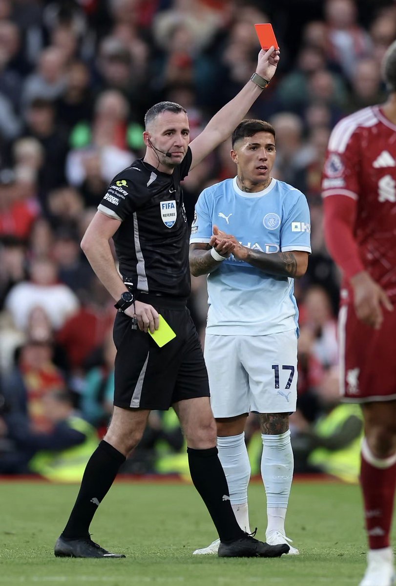ChinoUTD's tweet photo. 🚨 Roy Keane on Ryan Gravenberch’s red card against Manchester City:

“I watched it back because I thought I must have missed something.

Gravenberch is already on a yellow. Doku is trying to get away, Ryan tries to get a foot to the ball, catches him and the referee gives the foul. Fine. Nobody is arguing about the foul.

Then Chris Kavanagh reaches for his pocket again.

I said, ‘What’s he doing?’

The lad next to me goes, ‘He’s sending him off.’

‘For that?’

And there it is. Second yellow. Liverpool bloody down to 10 men.

Now people will say, ‘Roy, he was already booked. He should know better.’ Of course he should be careful. But being on a yellow card doesn’t mean you stop being a footballer. He’s allowed to compete for the ball.

Look at the challenge. He’s not flying in with both feet. He’s not going over the top of the ball. He doesn’t wipe Doku out with some wild lunge. He’s trying to make a challenge, gets it wrong, and Doku gets back up.

It’s around the middle of the pitch. Gravenberch isn’t the last defender. We’re not talking about a striker clean through on goal. You can give a free kick there and carry on playing football.

And don’t start telling me the referee had no choice. He did have a choice. That’s the whole point.

Someone said, ‘But Roy, the referee doesn’t have to warn him first.’

I said, ‘I know the rules. I’m not asking him to send Ryan a letter.’

A warning isn’t compulsory. A bit of judgement would be nice, though. You’re about to take one of the best players on the pitch out of Liverpool against Manchester City. You’d better be certain the challenge deserves another booking.

I thought Gravenberch was excellent in that first half. Taking the ball under pressure, driving past City players, making their midfield turn and chase him. He was giving Liverpool a way to get up the pitch.

And then he’s walking down the tunnel for a challenge that, to me, is an ordinary foul.

You could see what happened to the game afterwards. City have an extra man, Liverpool have lost a player who was carrying them through midfield, and suddenly the whole thing changes.

I played for Manchester United. I’ve got no reason to sit here making excuses for Liverpool. If Gravenberch had gone in recklessly, I’d be the first to say he deserved it.

But I played in enough of these matches to know the difference between a player losing his head and a player getting his timing wrong.

Ryan got his timing wrong. The referee, in my opinion, got the bigger decision wrong.

And the worst part? Tomorrow people will look at the score and say City were simply too good.

What we do know is that at 0–0, with eleven against eleven, Liverpool were in the game. That’s the match I wanted to see finished.

Not one decided by a referee who seemed in a greater hurry to reach for his pocket than to think about what he’d actually seen.”