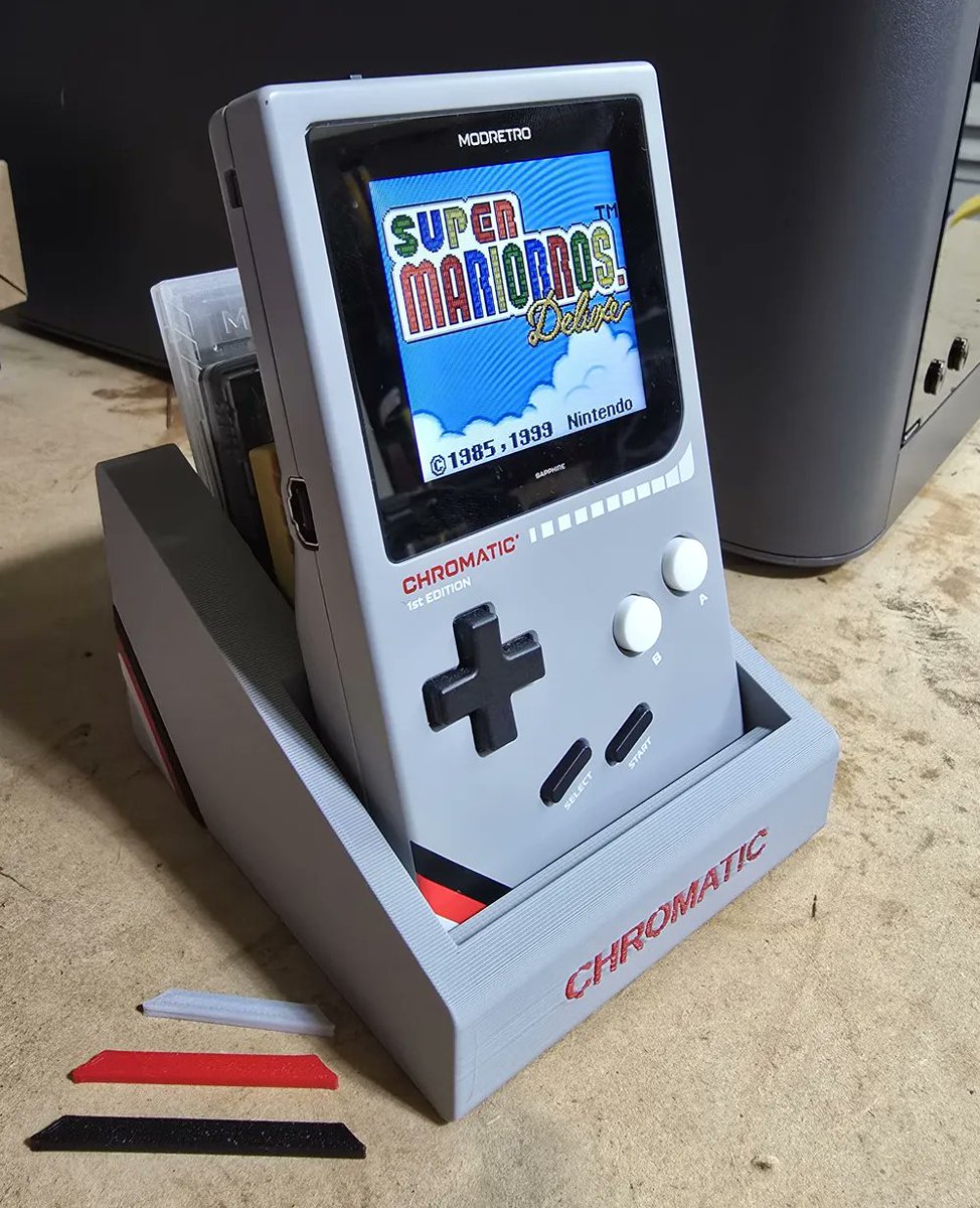 cycling776's tweet photo. Designed my own ModRetro Chromatic dock with AI and 3D printed it. Built-in cart storage and color accents to match the console. Should I post the files? https://t.co/kVSH9iFaxV