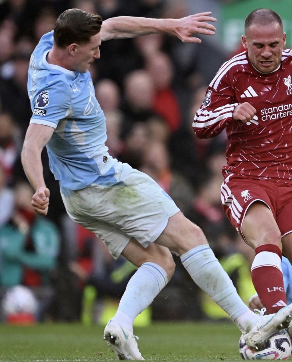 ChinoUTD's tweet photo. 🚨 Wayne Rooney on Elliot Anderson:

“During the Liverpool City game, I remember thinking something I probably shouldn’t say as a former United player.

How have City ended up with another one?

Because I’m looking at this lad and thinking, that’s exactly the type of midfielder I’d want in my team. Imagine United ended up signing him and Baleba. 

Not just because he can pass. There are plenty of midfielders who can pass a football when nobody is near them.

I’m talking about a player who wants the ball when the whole stadium is against him.

Anfield is one of the hardest places to play. I know that from experience. You can be having a perfectly good game, make one bad touch, and suddenly 40 or 50,000 people are letting you know about it.

Some players go quiet after that.

Anderson seems to get louder.

He gets fouled, stands up, and asks for it again.

Then he gets fouled again.

At one point I was thinking, ‘Surely they’ll leave him alone now.’

They didn’t.

Eight fouls. Eight times they brought him down.

I remember when I was younger, playing against experienced midfielders who would give you a little kick early in the match. Nothing dramatic. Just enough to let you know they were there.

You’d have a decision to make.

Do you start worrying about the next challenge, or do you keep playing your football?

Anderson made his decision very quickly.

What impressed me wasn’t even the amount of running he did, although covering more than 11 kilometres at Anfield is some shift.

It was what he did between those runs.

He’d win a challenge, move into space, take the ball under pressure and play forward. Then he’d be there again when City lost possession.

100 touches. 11 duels won. 71 completed passes.

Those are good numbers, but watch how he gets them. He’s not hiding in an easy position just to keep his passing statistics looking nice.

He’s involved in everything.

Then you look at Doku’s goal.

Anderson gets his head up and plays that long pass into the space. Doku takes it, runs towards the box, slows down, cuts inside and bends it into the far corner.

Brilliant finish.

But I always look at the pass before the goal. Anderson doesn’t just hit it forward and hope somebody gets there. He sees the run and gives Doku a ball he can attack.

That’s what good midfielders do.

Now, I look at him from an England point of view, and I think we’ve got a serious player here.

We’ve got some excellent attacking talent in this country. Everybody talks about the players who score, the players who dribble, the players who make the headlines.

But if England want to win major tournaments, we need players who can control the middle of the pitch when the opposition are trying to make life miserable.

That’s where Anderson interests me.

I don’t want to see him become a player who only looks good because City dominate possession. I want to see him take this personality into England games, especially against the strongest nations.

And from what I’m watching, I don’t think he’ll be frightened of that responsibility.

Someone asked me whether I thought he was the best player on the pitch against Liverpool.

I said, ‘For me, yes.’

They said, ‘Even with Haaland, Doku and Cherki scoring?’

I said, ‘Somebody has to do the work that allows those players to enjoy themselves.’

Anderson did plenty of that work.

Now, here’s the part that annoys me.

I look at United, and I look at the midfielders we’ve been crying out for over the years. Players with energy, aggression, intelligence, who can handle the pressure and actually want responsibility.

Then I turn on the television and see one doing all of that in a Manchester City shirt.

I’m delighted for England, don’t get me wrong.

But as a United fan, watching him dominate the midfield at Anfield for City is a very strange feeling.

Because I spent years enjoying beating Liverpool.

I never imagined I’d be sitting at home wishing one of City’s midfielders was wearing red while doing it.”