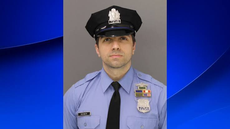 TonySeruga's tweet photo. 🚨 HE ANSWERED A CALL FOR HELP. HIS CHILDREN WILL NEVER HEAR HIM COME HOME.

A 7-year-old boy and a 3-year-old girl have lost their father.

Philadelphia Police Officer Shane Seiber. Remember his name.

Forty years old. A husband. A father. Ten years serving his city.

Early Saturday, October 10, Seiber and another officer responded to a report of a man with a gun in West Philadelphia. Authorities say they were ambushed as they approached a porch.

Seiber was shot three times. He died at the hospital with his wife and family beside him.

The second officer—a 33-year-old father of five—was shot TWELVE times. He survived surgery and remains hospitalized in stable but serious condition.

Two fathers. Seven children whose lives have been changed forever. 💔 a

Authorities say the accused gunman also fired at nine responding officers. Eric Lewis, 35, now faces murder and 10 counts of attempted murder. He is being held without bail.

Every emergency call asks someone to step into danger. These officers answered.

Their families deserve more than a news cycle of sympathy. They deserve sustained support, a community that remembers, and justice pursued with the full seriousness this attack demands.

🙏 Pray for Shane’s wife and children. Pray for the wounded officer and his family.

And when the headlines move on, keep saying his name. 🕯️

Officer Shane Seiber.

He answered the call. Now we must answer for his family. 💙