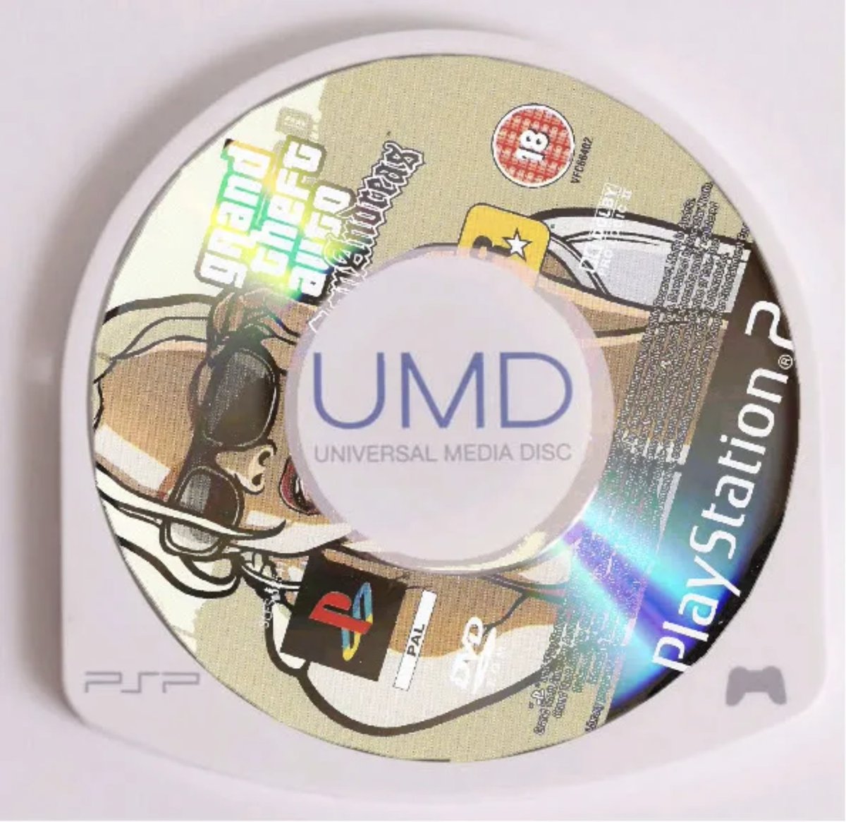 RKELLAS's tweet photo. May 21, 2006 - a further attempt to convince the forums that I had a real copy of the GTA:SA on PSP . Pay no mind to the fact the disc clearly says 'Playstation 2'

The disc is likely my first ever photoshop work. The photo was a PS2 screenshot loaded up in the PSP photo viewer.