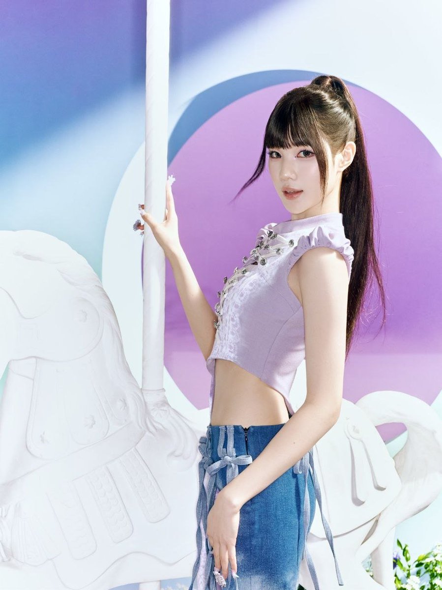 rkimjuun's tweet photo. a dreamy pastel wonderland in lilac and baby blue, where delicate details meet playful elegance. a lavender corset top, denim accents, and a sleek high ponytail create a sweet yet confident look against a whimsical carousel backdrop. https://t.co/8LkkMPT3gl