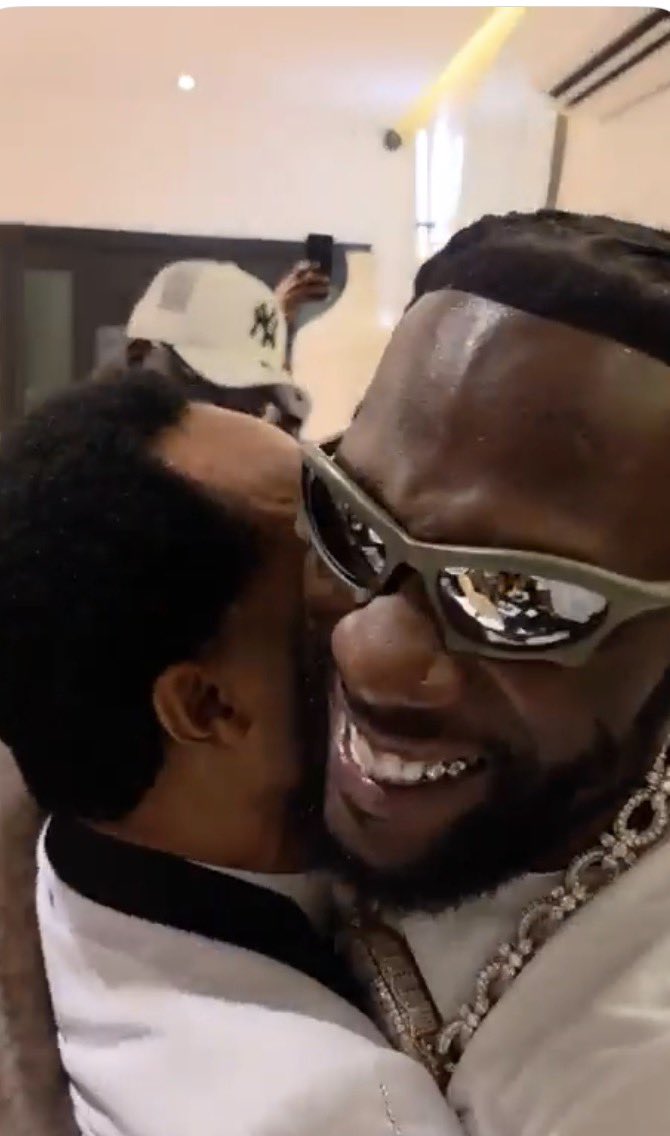instablog9ja's tweet photo. Singer Burna Boy and Pastor Odumeje steal the spotlight as they share a playful moment during an event https://t.co/70fxkR55kE